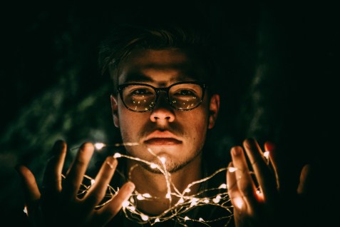 Young man glasses lights_jonathan-crews-194055