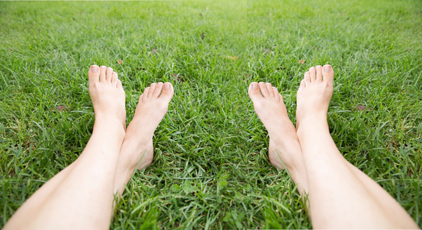 2 pairs bare feet grass by Teagan
